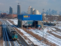 CN P07331 14 with a CAD rebuild blast through Mimico on it's way to Windsor with the Toronto skyline looming in the top right.