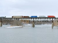 CP 240 Crossing the Grand River with a colourful consist which includes a SOO Bandit