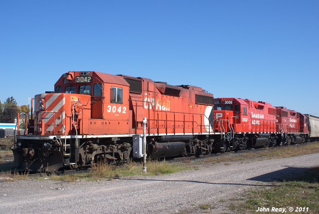 Power for the Havelock turn seen laying over in Havelock yard on Thanksgiving day 2011, including the freshly repainted 3038