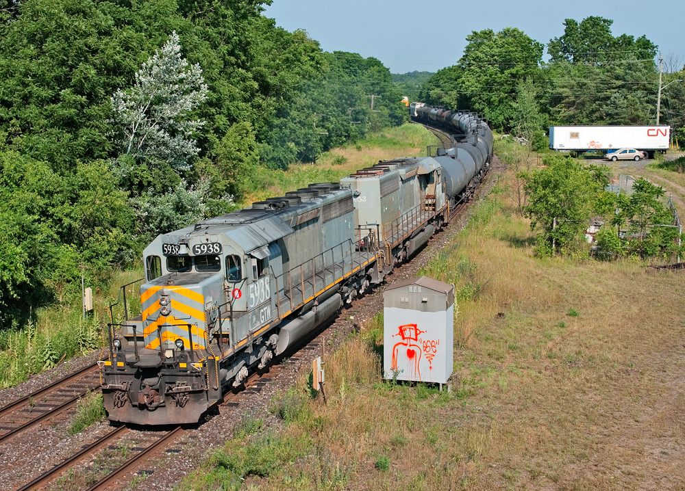 After finishing up on a L58031 06 out of Brantford, I looked into my magic 8 ball and saw CN A43531 06 with a pair of grey GTW SD40-3's as sole power, here they are beginning to throttle up through the serpentine curves and into Paris Jct.