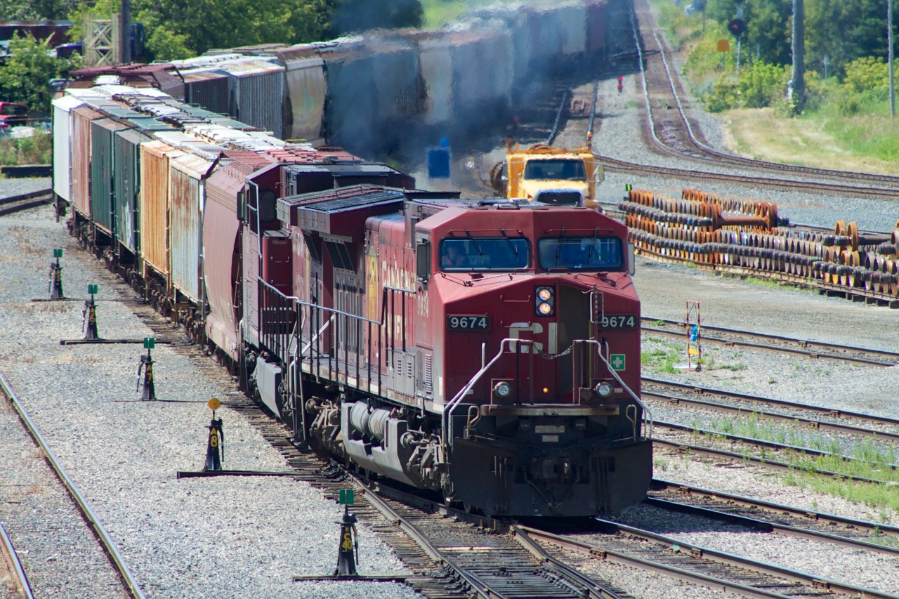 CP 9674 (GE AC4400CW) powers up to switch tracks as it leads a meandering hopper freight into Thunder Bay's Westfort Yards.