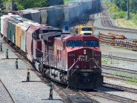 CP 9674 (GE AC4400CW) powers up to switch tracks as it leads a meandering hopper freight into Thunder Bay's Westfort Yards.