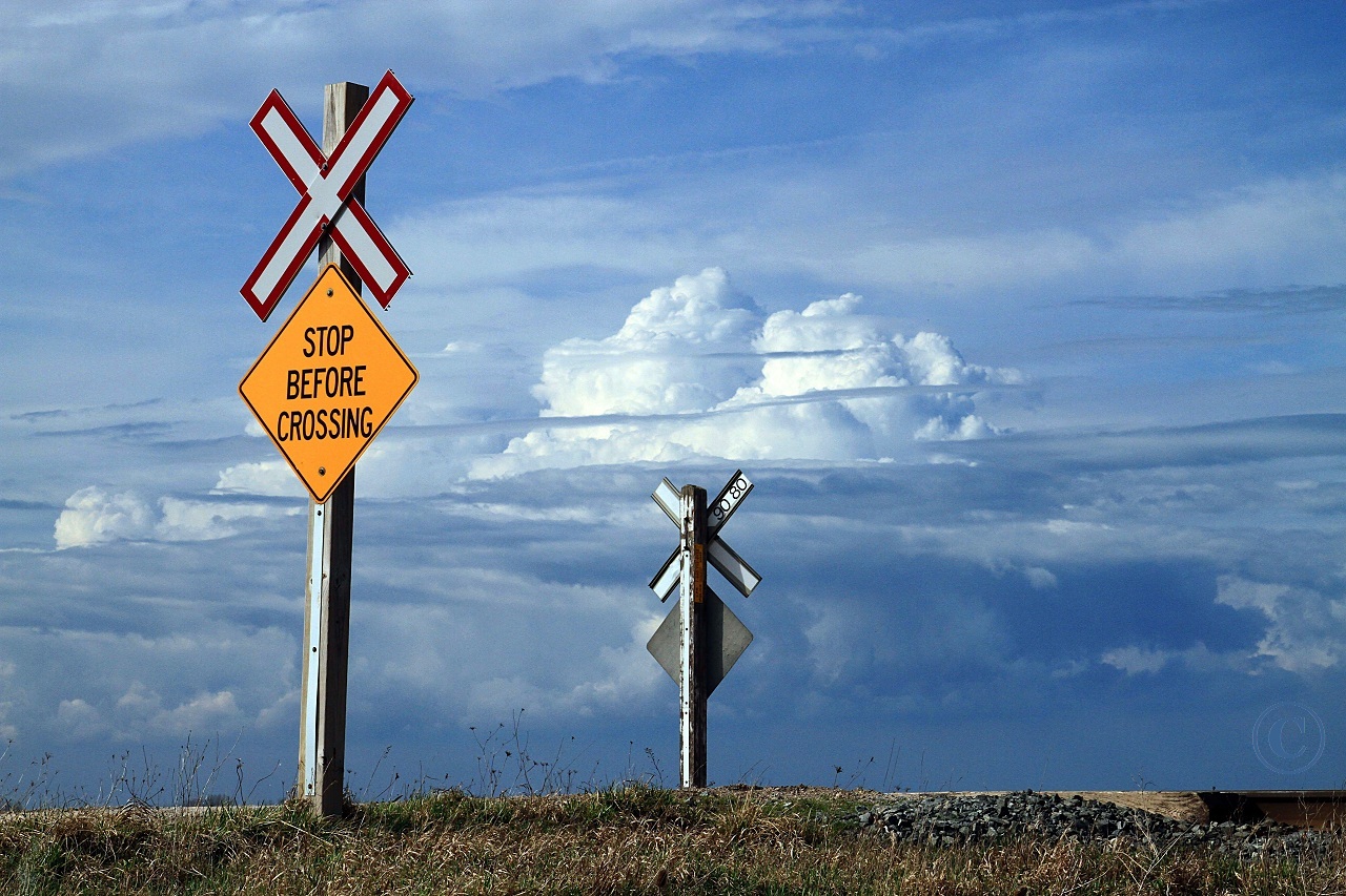 Storm clouds build to the north of the rural CP crossing at mile 90.8 on the CP's Windsor Sub March 18, 2012.