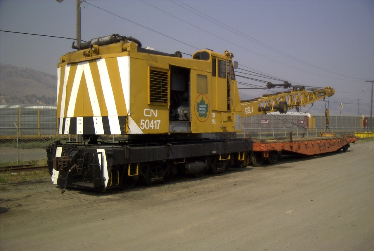 CN 50417 has been repainted in a retro-scheme to honour the crane used in the construction of the Great Slave Lake Railway which began in 1962.  This Wellman model DE 400, s/n 4402 locomotive crane was built new in 1962.  The crane is unique in that neither the name WELLMAN or OHIO is cast into the counterweight at the back of the crane.  Operator Danny MacIlroy has the 50417 in absolutely pristine condition on this beautiful September day.