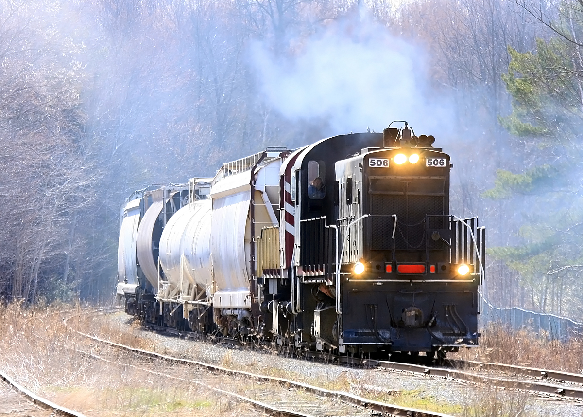 Bruce-ster lays down a smoke screen as he passes the Sharpe Feed Mill siding at Moffat, heading for Guelph on this chilly April morning.