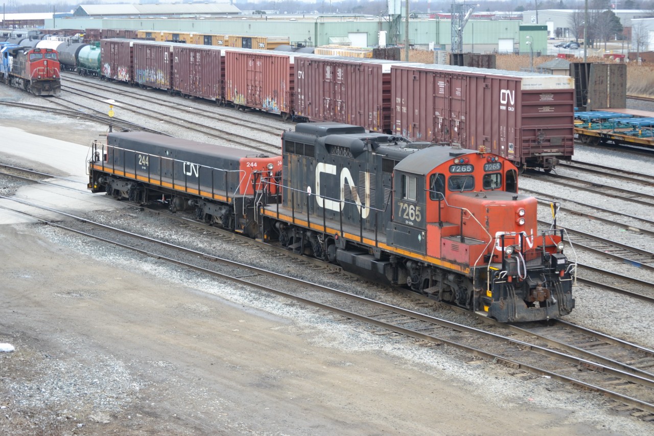 CN 7265 and CN 244, a set of Sarnia local Remote power, backs up into CN Sarnia Yard, after setting out cars on another track for CN 330 train.