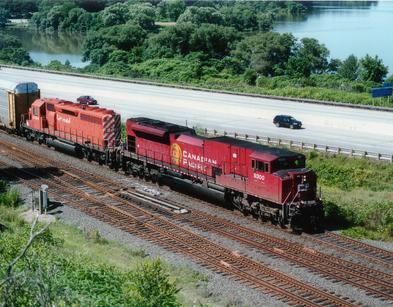 It didn't ahppen very often, but at least once I was able to snag a shot of an SD90MAC-H on the lead of a Hamilton-area train. Here #254 with CP 9300 and SD40-2 5696 are northbound about to duck under the High Level Bridge in west Hamilton. A strangely light Hwy 403 is in the background.