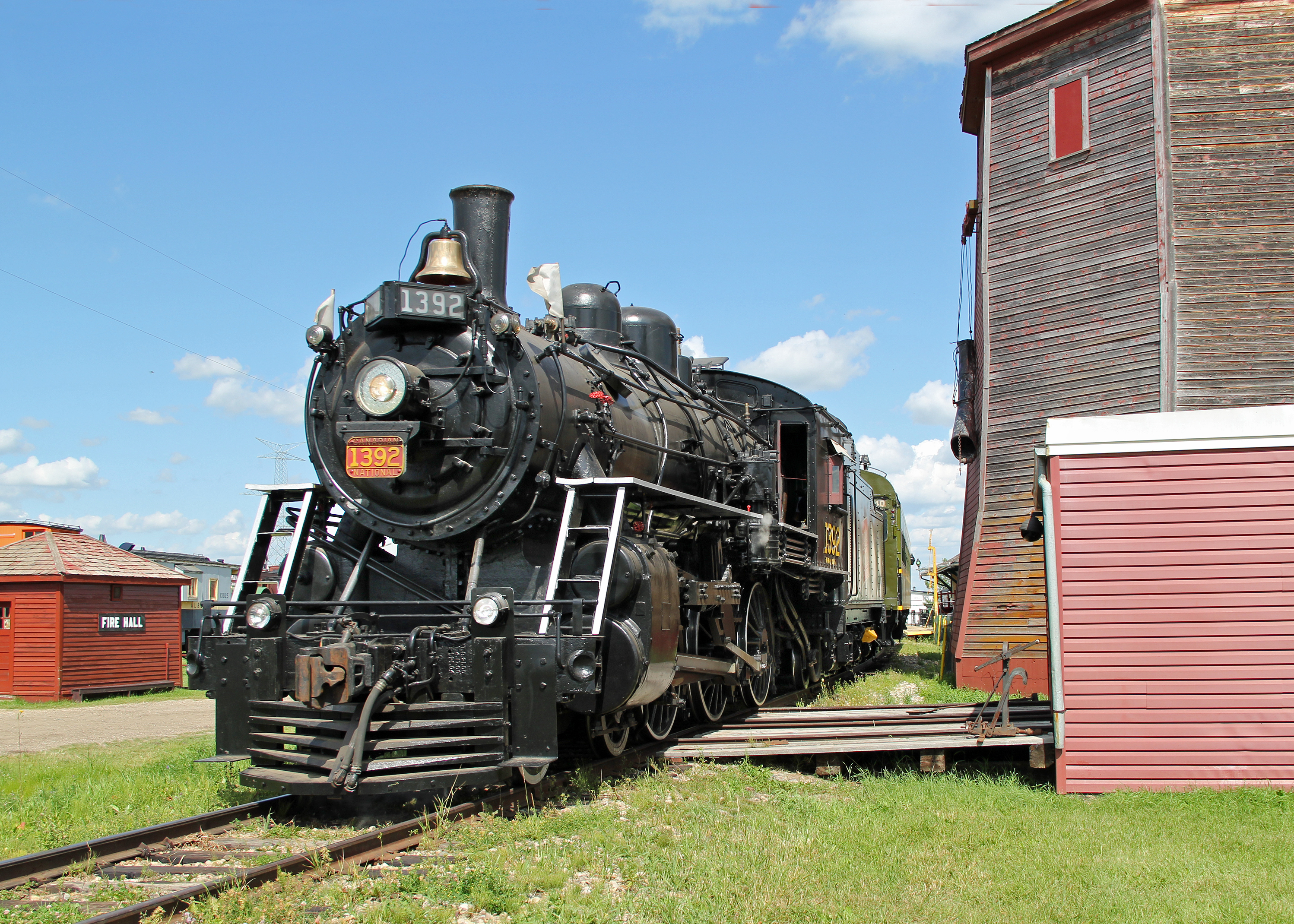  colin arnot Photo: MLW 4-6-0 CN 1392 passes the preserved  Gibbons water tower at the Alberta Railway Museum