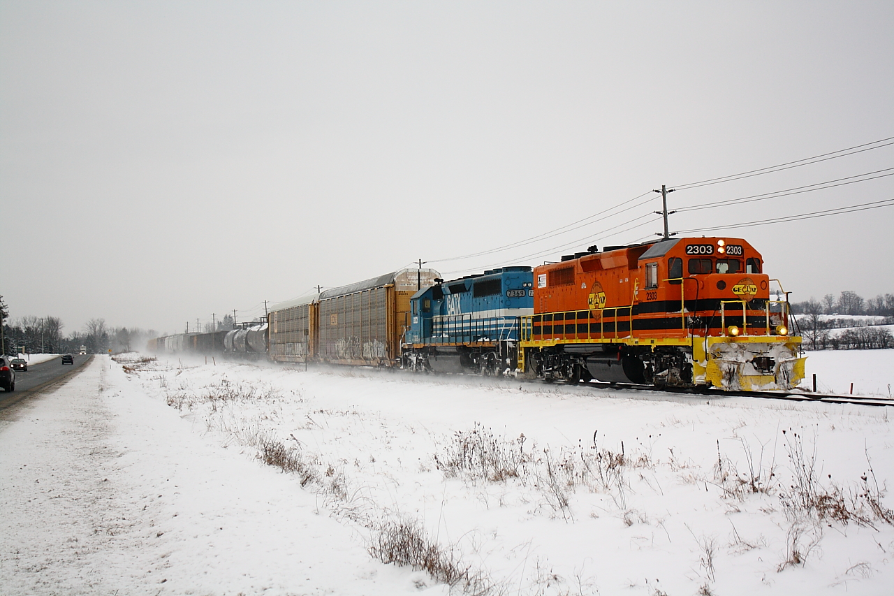 With exams ending late last night today was my first official day of Winter break.  What better of a way to kick it off than a chase of the GEXR.  Here we see GEXR 432 back up to track speed and hauling butt with GEXR 2303 and GSCX 7369.