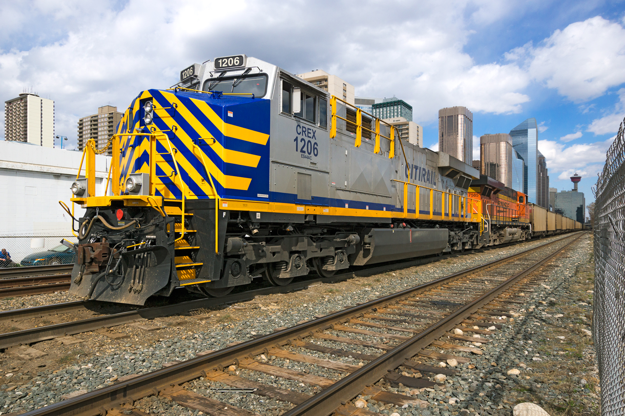 A loaded PRB coal train sits at the "Depot" in downtown Calgary with CERX 1026 and BNSF 7585 on the point. When a new crew takes over, it will back through the west end of Alyth yard, then head north on the Red Deer subdivision. Then, it will be handed off to CN in Edmonton for forwarding to Prince Rupert.