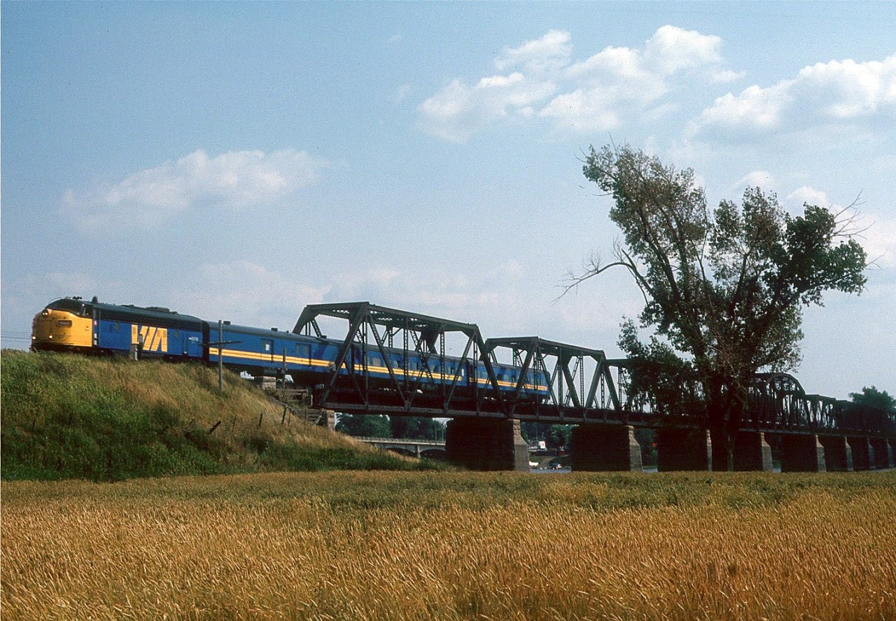 An ex CN FP9 crosses the Laurier Railway Bridge at Rivière-des-Prairies–Pointe-aux-Trembles just north of Montreal, Quebec in August of 1989.