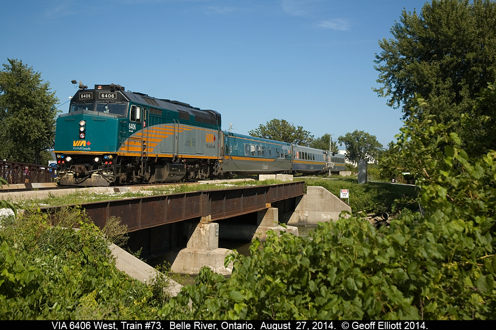 VIA #73, with 6406 in charge, cruises through, and over, Belle River, on a beautiful August day while on it's way to Windsor.