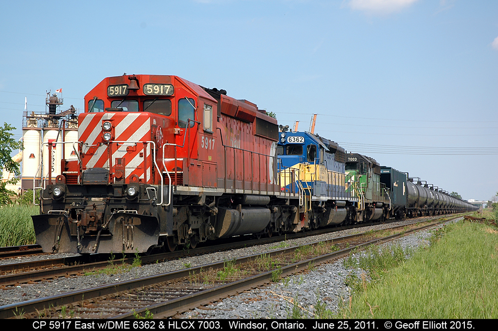 Dash 2's a plenty always seemed to be the 'norm' in the 80's and 90's on the Windsor Subdivision, but they weren't always this colorful.  Today we have a nice "elly-style" lashup with CP SD40-2 #5917 heading up IC&E 6443 (ex-UP 3705) and HLCX (ex-BN same #) 7003 on a westbound empty ethanol train as it waits on a new crew to take it from Canada into the U.S. via the Windsor/Detroit rail tunnel.