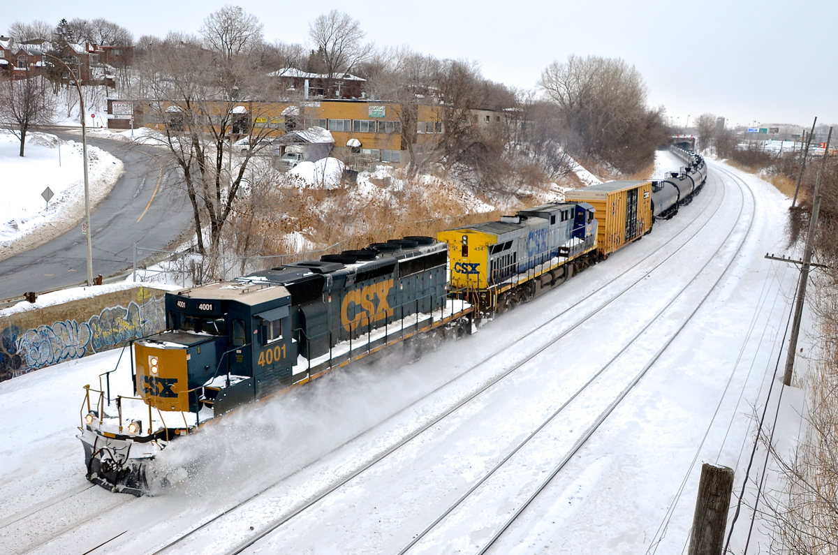 CSX kicking up the snow.... in Quebec. CN 323 is returning to Montreal a day later than usual with CSXT 4001 and CSXT 454 as power. Usually CN 324 goes from Montreal to St. Albans, VT and comes back as CN 323 on the same day. However last night CN 324's crew spent the night in St. Albans and returned back a day later. Seeing a CSX SD40-3 leading in Quebec is not common at all.