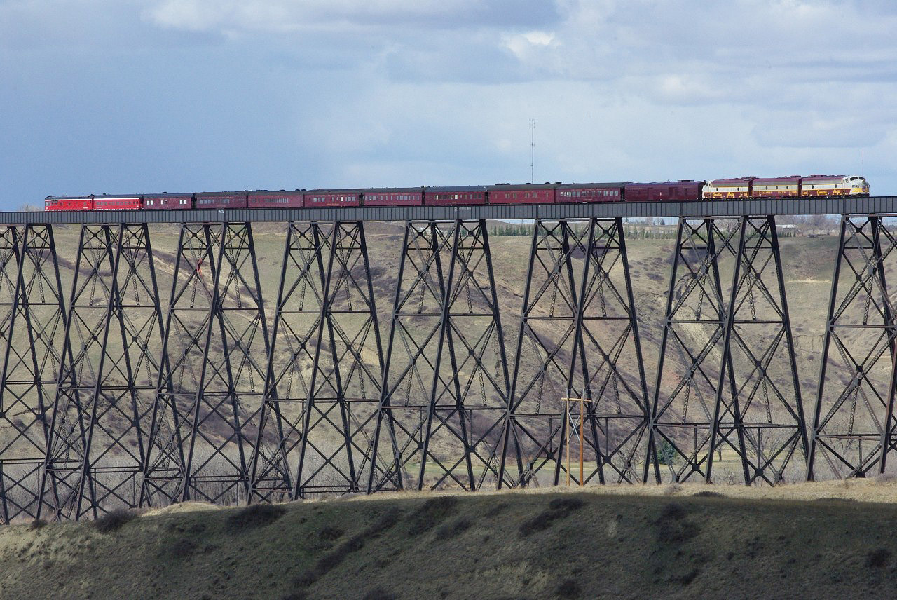 The CPR Royal Canadian Pacific train is on the Lethbridge viaduct and is about to back up to Lethbridge Yard for its return trip to Calgary from Portland, Oregon.  It was showing its riders the massive bridge, a mile long and 320ft high, that spans the Oldman River in Lethbridge.  The locomotives are FP9u 4107 and 4106 with B unit 1900.