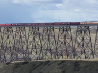 The CPR Royal Canadian Pacific train is on the Lethbridge viaduct and is about to back up to Lethbridge Yard for its return trip to Calgary from Portland, Oregon.  It was showing its riders the massive bridge, a mile long and 320ft high, that spans the Oldman River in Lethbridge.  The locomotives are FP9u 4107 and 4106 with B unit 1900.