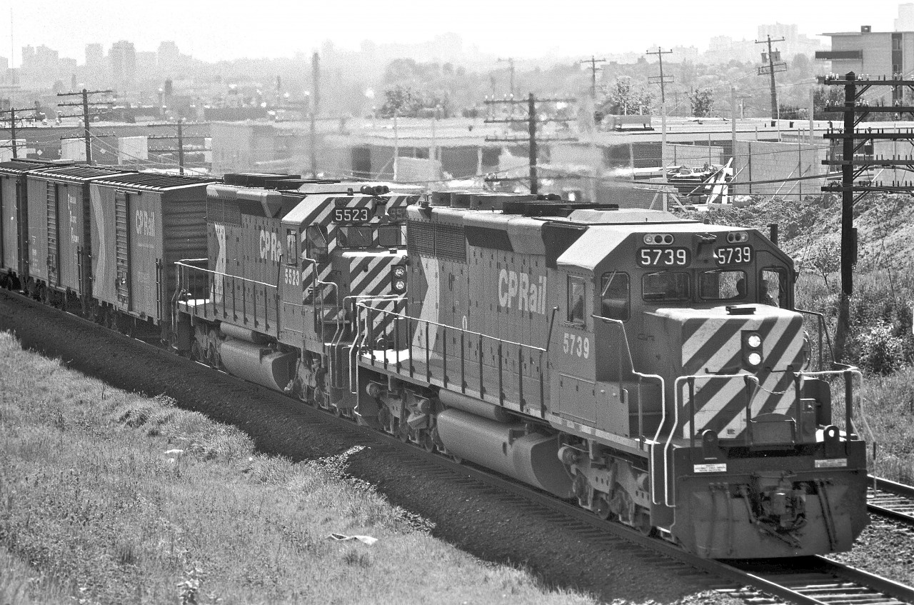 It seems that Mr. James Adeney and I shared the same idea... capture some SD40's near the Victoria Park bridge in Scarborough.


 
Check out his awesome shot...





http://yourlink.com 




 
James whooped me in the horsepower department, but at least I beat him to the scene (by a mere 22 years)! Notice the townhomes in his image? Back in '76, my photograph shows that only the cement block walls were standing. SD40-2, #5739 was barely a year old, while locomotive #5523 was celebrating a tenth birthday.

 
This shot was taken three years into my teens. I was still working to figure out all this aperture and shutter-speed stuff on my older brother's Pentax Spotmatic 1000. Wow... 39 years ago... seems like just yesterday... crazy!


James... you have a wonderful portfolio here on RPca... thanks for sharing!