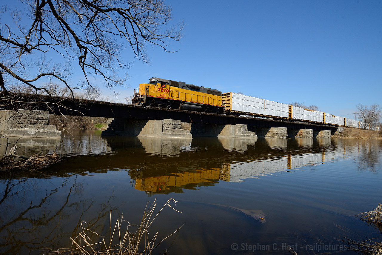 GEXR Train 582 is crossing the Speed River at Hespeler Ontario on a railway built in 1854 to reach Guelph from Galt. No expenses were spared on this portion of the railway - a substantial structure compared to rickety wooden bridges you typically see on Branches. I'm standing basically on the Grand River Railway right of way which ended at Hespeler and crossed the CN at grade just beyond the bridge.