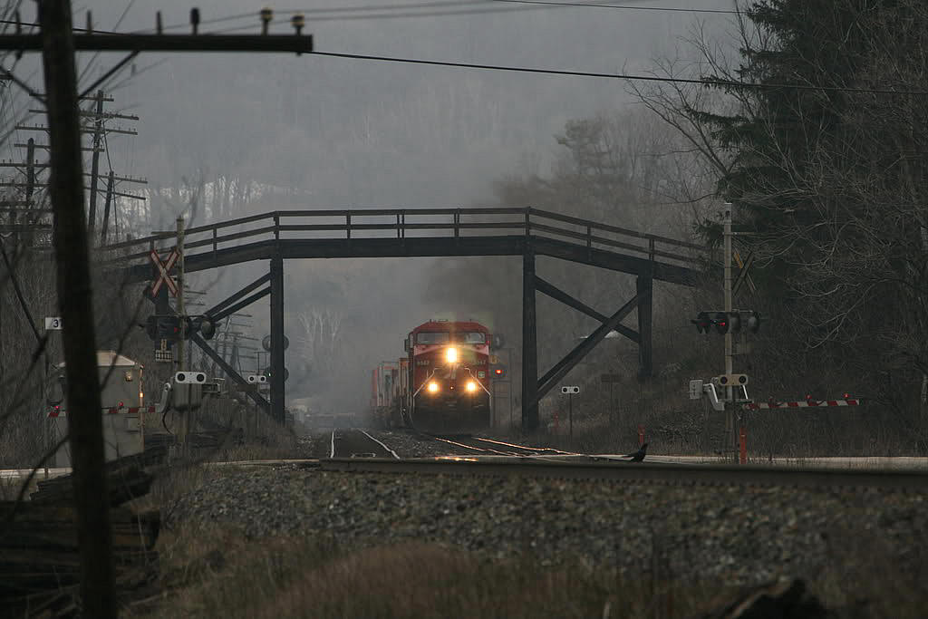 A very mild January winter day..has set the mood here..most snow has melted and everything is brown plus low cloud cover is hanging over....CP 159 hustles the usually moderate 6000 foot train up the hill through the wooden bridge.