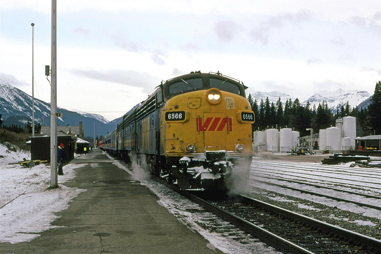 The eastbound "Canadian" makes a brief stop at Banff on Hew Year's Eve. An interested onlooker is nearby.