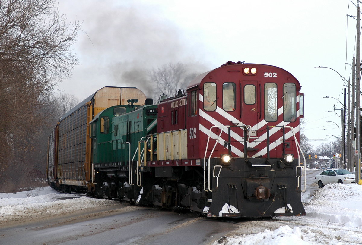 Ontario Southland S-13's 502 and 501 hustle a string of autoracks to Cami from interchange with CN in Beachville