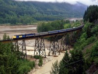 The westbound "Super Continental" crosses the Anderson Creek bridge just south of Boston Bar. The high water levels in the creek and Fraser River suggest that it has been raining a lot lately and that the Spring thaw is well underway.