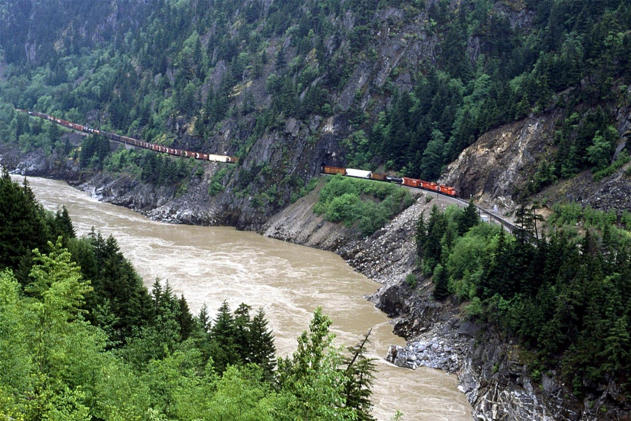 Eastbound CP manifest train in the heart of the rugger Fraser River valley, just north of Spuzzum, and nearing Hell's Gate.