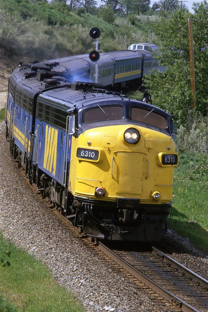 A little oil is being consumed in the engine as the locomotives throttle up after passing over the east switch of Brickburn.