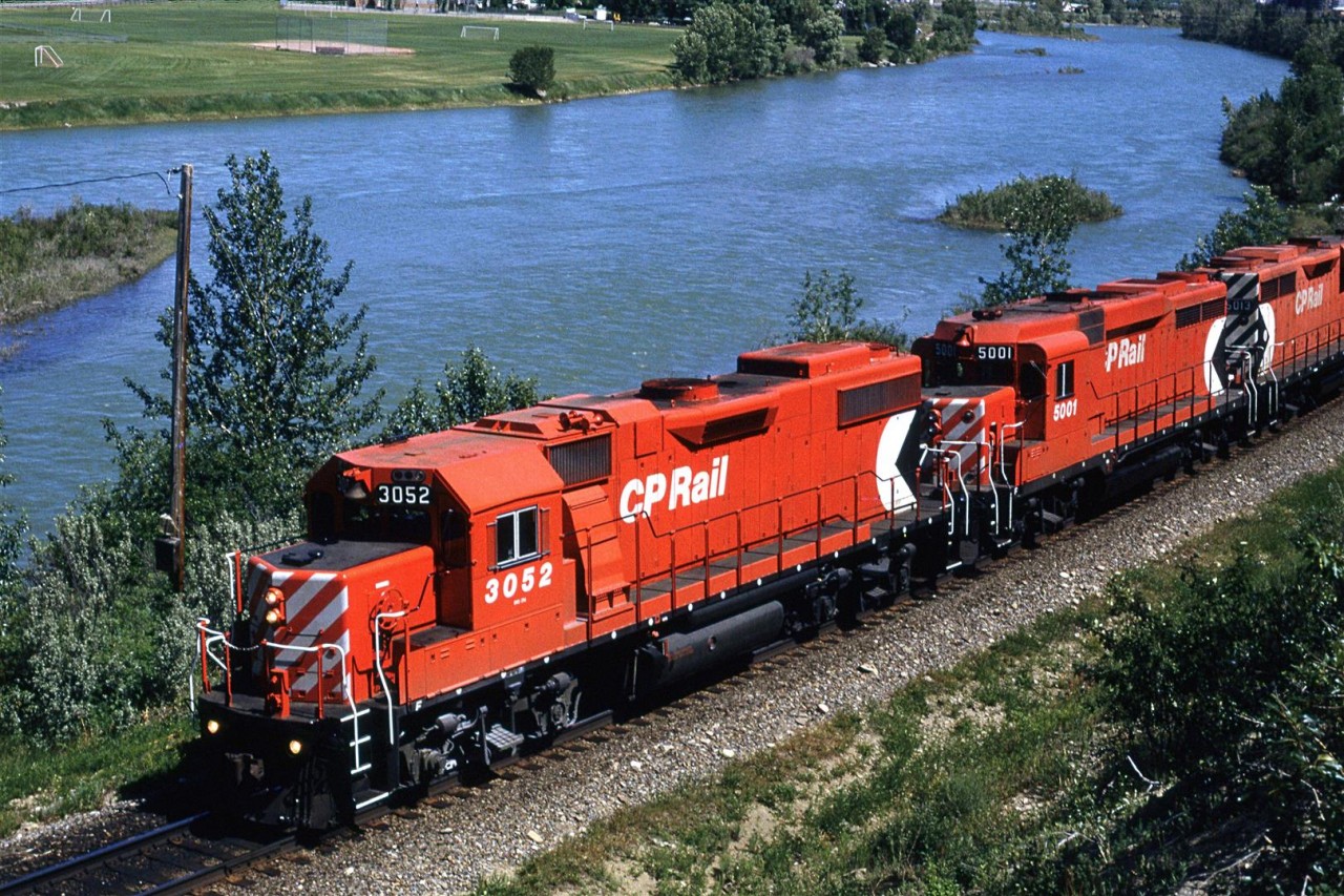 The lead unit isn't that remarkable, but the trailing GP-30 is. It is one of the two such units owned by any Canadian RR (OK SOO had a few but they operated south of the border).
The Bow River is in the background.