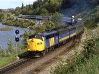 In the mid 80's there was a "Day in the Life of...." craze (for lack of a better word). This was the first railroad-related event - preceding CTC Board's first Day in the West (In a few years it would become all of Nort America) by one day. Someone in St Catherines of Welland was organizing the event and asked photographers to make submissions. I sent is several shots that I had taken that day, but nothing ever became of the project. Nor were my slides ever returned to me. I am still rather ticked. 

Here is the westbound "Canadian" at Brickburn's east switch, along the Bow River.