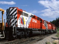 An eastbound cap hop crosses the east switch of Brickburn with the third unit sporting the EXPO '86 paint for CP's "Rainbow Wars" exhibit.
These cab hops mystified me. Did they drop a train at Kieth or did they come a long distance without and revenue car?