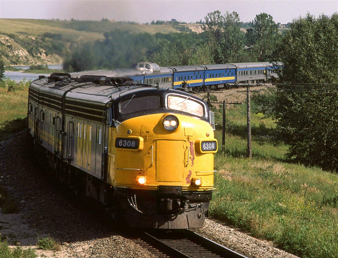 At 1518hrs, the westbound "Canadian" was running a few hours late, as it headed out of Calgary. The Bow River in the background was just crossed by the train.