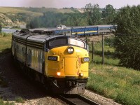 At 1518hrs, the westbound "Canadian" was running a few hours late, as it headed out of Calgary. The Bow River in the background was just crossed by the train.