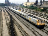 The LRC train is likely a revenue move, however the train that is somewhat blocked it more likely a transfer from Mimico, what with 2 engines, two passenger cars and four RDC's.
It was a very heavily overcast morning in Toronto. Shortly thereafter the rain would start.