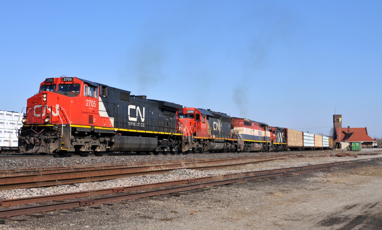 435 passes through Brantford with IC 2705 - CN 5379 - BCOL 4605 - CN 4136 and 20 cars