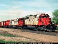 SOO Line 6620 and 780 lead a CP 1/2 sister into Canada after traversing the Windsor/Detroit railway tunnel on CN's CASO Subdivision with CP train #508 on April 27, 1990.  The train is rolling over the 'new' back track at Windsor South and is technically now on CP's Windsor Subdivision.