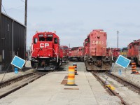 One of Agincourt's yard remote GP38-2 units on track 1 east after a maintenance inspection beside SD40-2 5857 that is in storage along with other SD's some of which are waiting on bids for sale.