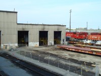 In 2011 the Diesel Shop at Agincourt was undergoing a complete makeover. This view shows the west end as contractors are getting ready to start interior demolition while hump remote set 1159 and a local set of 2 GP38-2's sit on the south tracks.