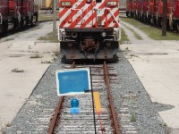 One of two red barns left in storage at Agincourt sits between tracks of stored SD40-2's.