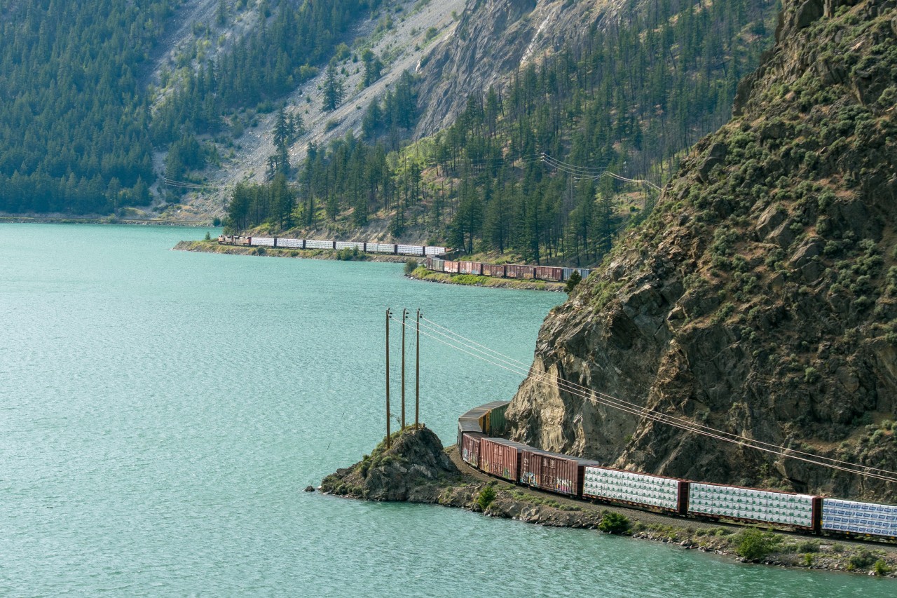 Where two-tone green MLWS and self-propelled Budd cars used to roam, a pair of CN SD70M-2s lead daily Prince George - Squamish train 570 along the shore of Seton Lake on the former BC Rail.