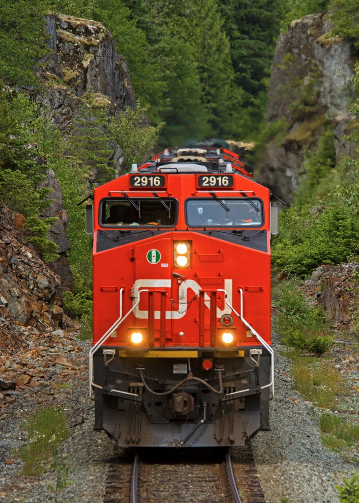 Canadian National ES44AC 2916 blasts through the rock cut at CN conductor Mike Thomas's "Secret Spot," north of McGuire siding on the former BC Rail's Squamish Sub.