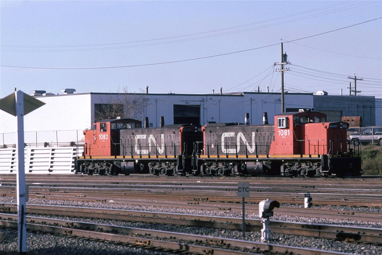 I moved to Edmonton to attend the University Of Alberta. 
There were times when I needed to get out so I would bike up to the CN tracks on the north side of the city.
I always liked the look of the GMD-1's. Here, there are waiting their next task outside Calder Shops.