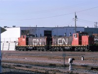 I moved to Edmonton to attend the University Of Alberta. 
There were times when I needed to get out so I would bike up to the CN tracks on the north side of the city.
I always liked the look of the GMD-1's. Here, there are waiting their next task outside Calder Shops.