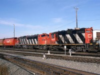 I believe that this is the train coming in from the Westlock Sub. It might have been #418 - at least that is what it was several years later. It may also simply have been a grain train from the Westlock Sub - the giveaway is the lightweight power. 
It is one of the very few shorts that I have of F units in freight service. 
On this occasion, there was another railfan beside me recording the scene on video. I commented that the lighting sucked before I realized that he was recording. Encounters with other railfans were very rare for me, and I was not up on the etiquette. So, if that guy ever reads this, I apologize again. 
The going away shot has better light. 