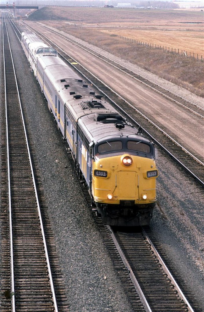 The eastbound "Super Continental" zips into west Edmonton, looking very similar to the "Canadian" that ran through Calgary on CP's tracks at that time.