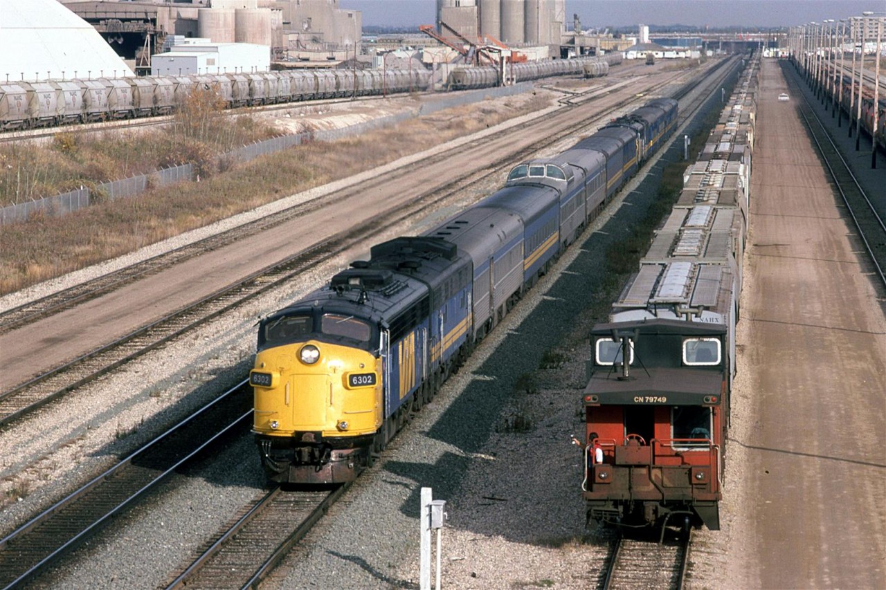 Shortly after the eastbound "Super Continental" passed, the Westbound counterpart came into view. Note that the "Skeena" was tacked on to the rear of the #3. This was SOP at the time. The "Skeena" only ran on alternate days, so one could catch the eastbound or the westbound, but not both #3's running like this 6 days a week.
Bissell yard was put in to handle unit trains in order to keep them from clogging the confined Calder yard, a couple miles to the east .