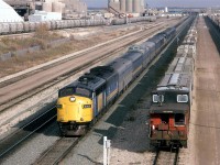 Shortly after the eastbound "Super Continental" passed, the Westbound counterpart came into view. Note that the "Skeena" was tacked on to the rear of the #3. This was SOP at the time. The "Skeena" only ran on alternate days, so one could catch the eastbound or the westbound, but not both #3's running like this 6 days a week.
Bissell yard was put in to handle unit trains in order to keep them from clogging the confined Calder yard, a couple miles to the east . 