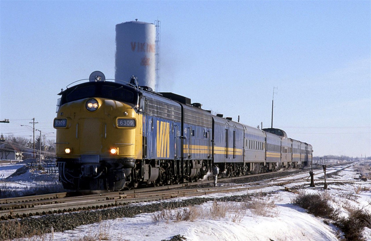 Judging by the date, I must have finished my final exams for the term, and I convinced my wife to drive east of Edmonton to catch a few trains.
This westbound "Super Continental" doesn't appear to have the pre-Christmas swelling of its consist as of yet.
The air is still quite cold, but the sun appears to be warming the south side of the train. That was one thing that I liked about Alberta. The sun would shine when it was really cold - not like in the east where it would be damp, not as cold and overcast.