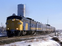 Judging by the date, I must have finished my final exams for the term, and I convinced my wife to drive east of Edmonton to catch a few trains.
This westbound "Super Continental" doesn't appear to have the pre-Christmas swelling of its consist as of yet.
The air is still quite cold, but the sun appears to be warming the south side of the train. That was one thing that I liked about Alberta. The sun would shine when it was really cold - not like in the east where it would be damp, not as cold and overcast. 