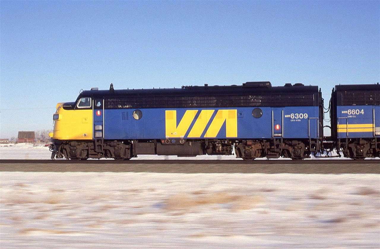 A pacing shot of the westbound "Super Continental" from highway 16 near Riley. We received some strange looks from the cab as we paced the train for a mile or two.